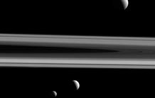 Reaching for the Moon to Determine the Nature of Saturn's Central Core